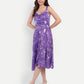 Woman wearing Aifa purple floral sleeveless midi dress