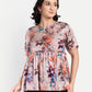 Women’s beige floral Millie top with peplum style, soft flowy fit and elegant stylish design