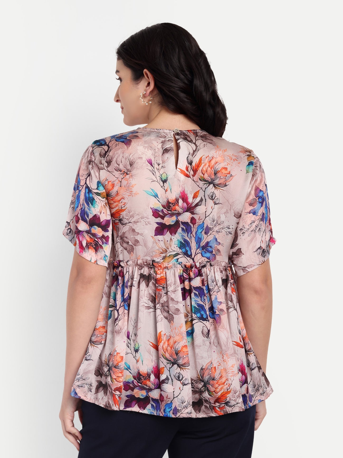 Women’s beige floral Millie top with peplum style, soft flowy fit and elegant stylish design