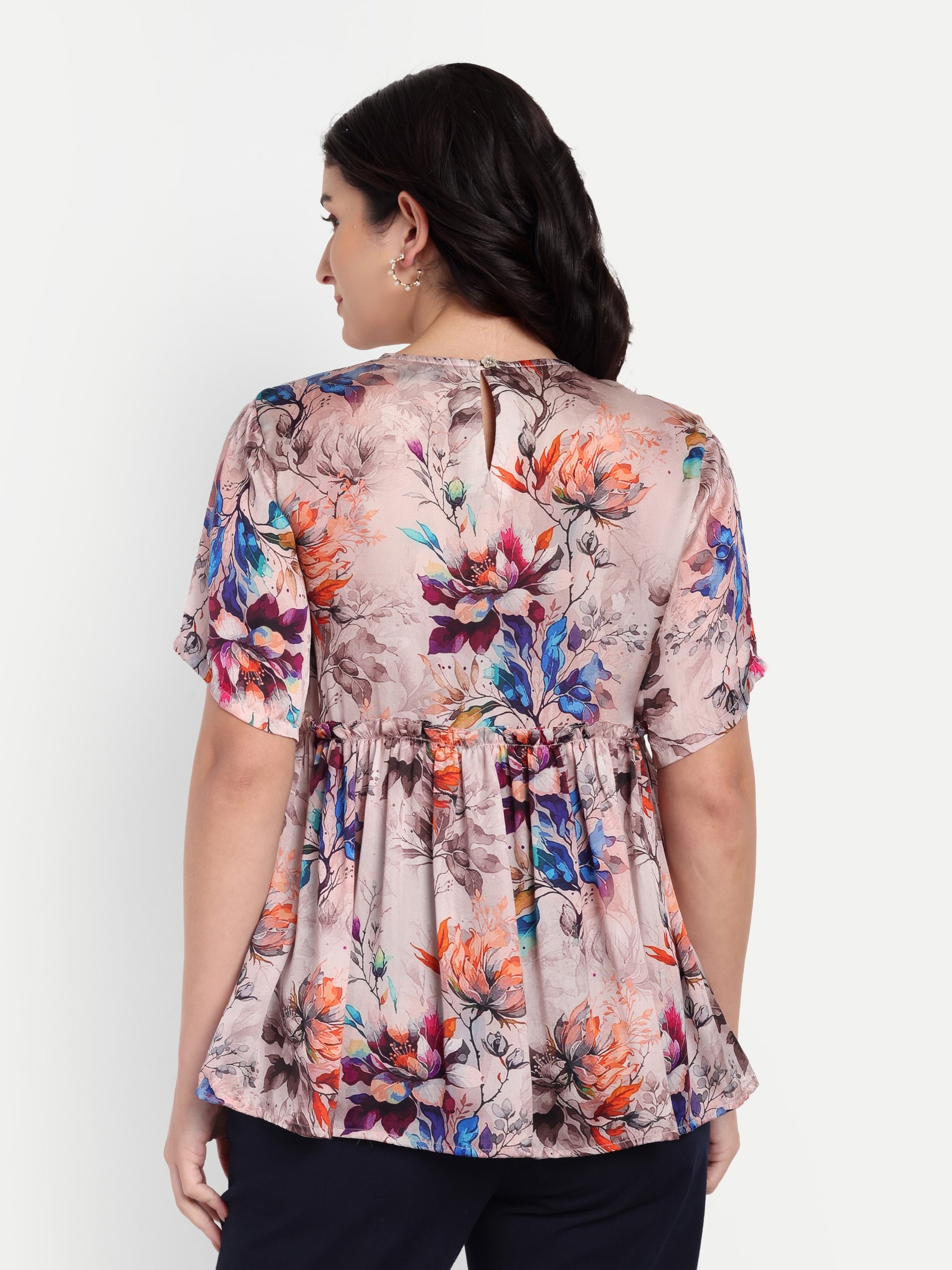 Women’s beige floral Millie top with peplum style, soft flowy fit and elegant stylish design