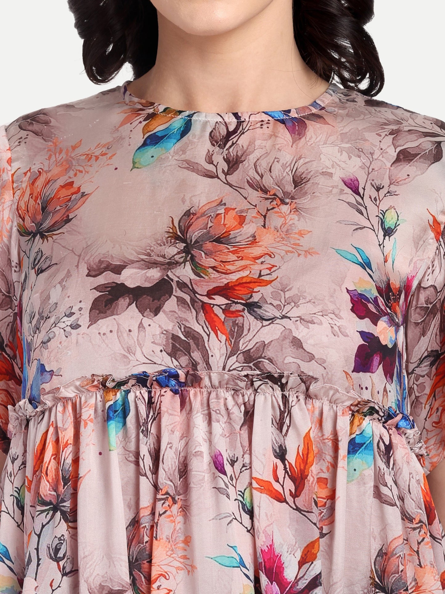 Women’s beige floral Millie top with peplum style, soft flowy fit and elegant stylish design