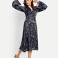 Women’s black and blue floral Reko midi dress with V-neck and elegant flowy fit