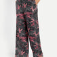 Women’s black printed Freya wide-leg pants with relaxed fit and statement floral design