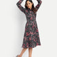 Women’s black printed Luna midi dress with long sleeves, button-down front and elegant fit