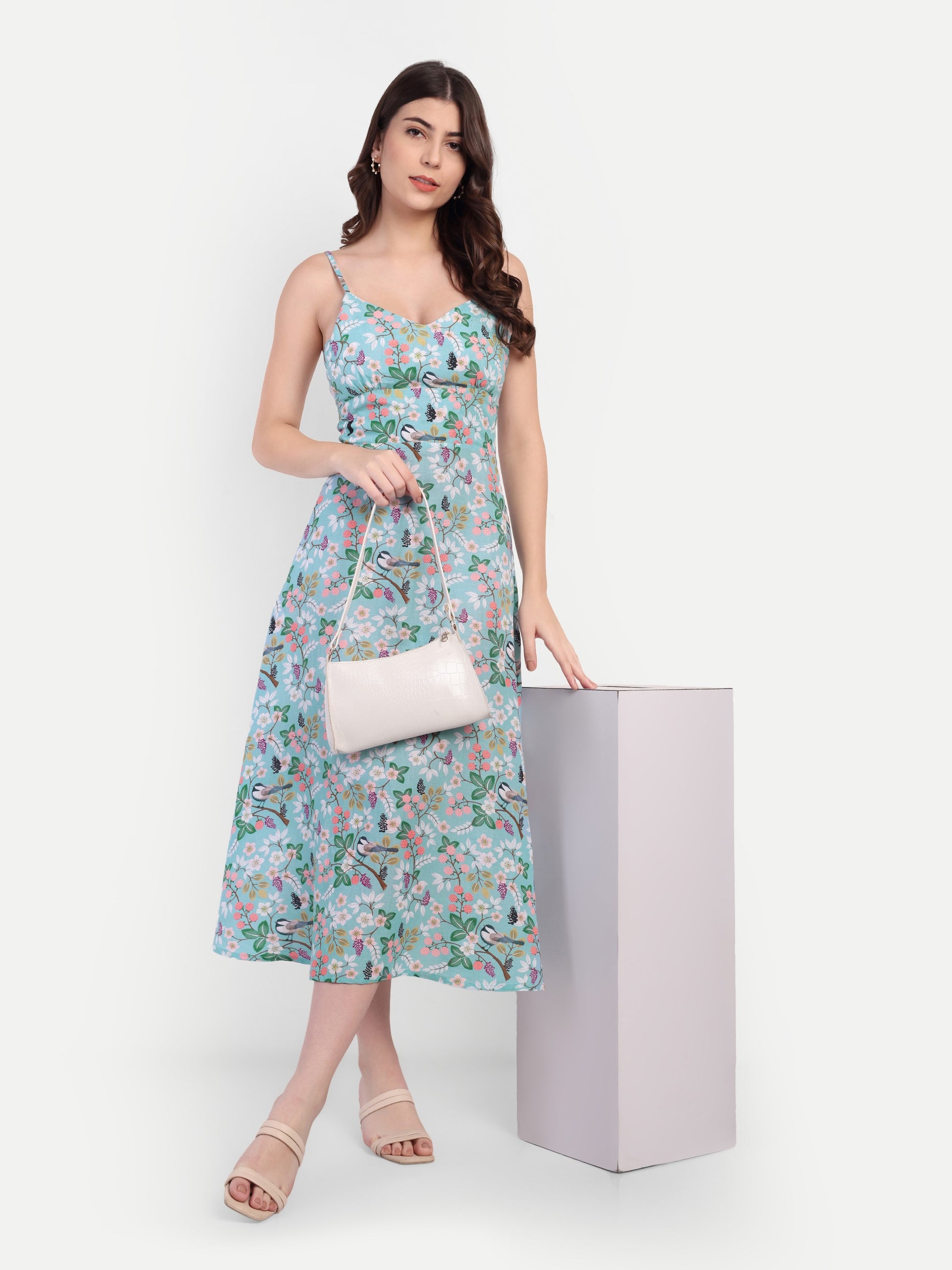 Women’s blue floral Manto midi dress with sleeveless design and fitted silhouette