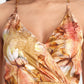 Women’s golden floral Vento maxi dress with halter neck and flowy silhouette