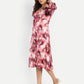 Women’s red printed Dezi midi dress with long sleeves and elegant relaxed fit