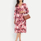Women’s red printed Dezi midi dress with long sleeves and elegant relaxed fit