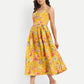 Women’s yellow floral Meto midi dress with strappy sleeves and flowy summer silhouette
