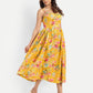 Women’s yellow floral Meto midi dress with strappy sleeves and flowy summer silhouette
